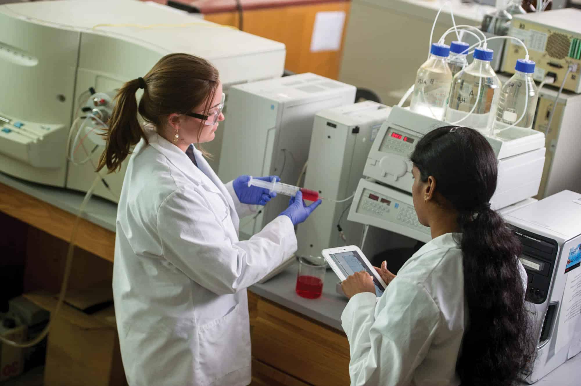 Two students in a chemistry lab