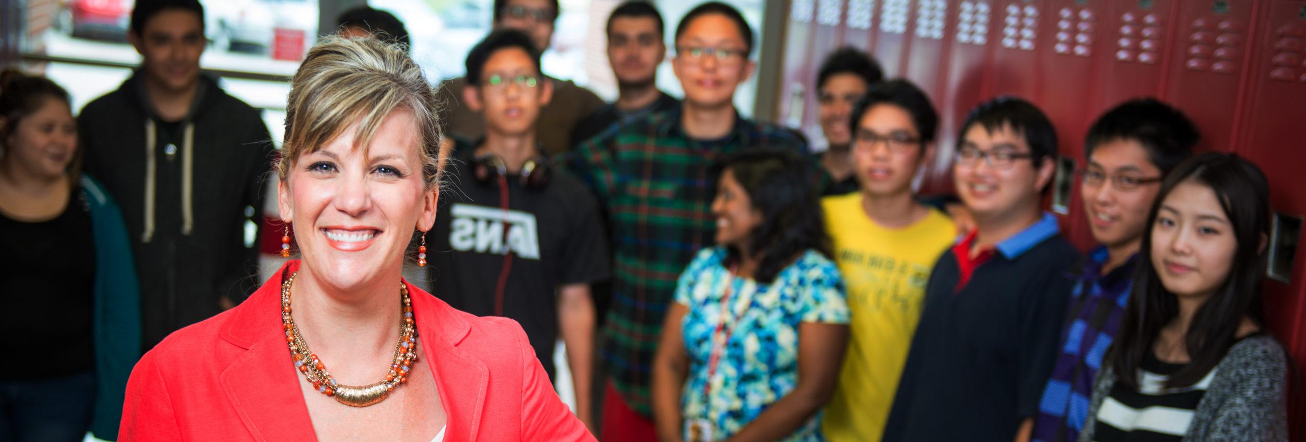 Teacher standing in front of high school students