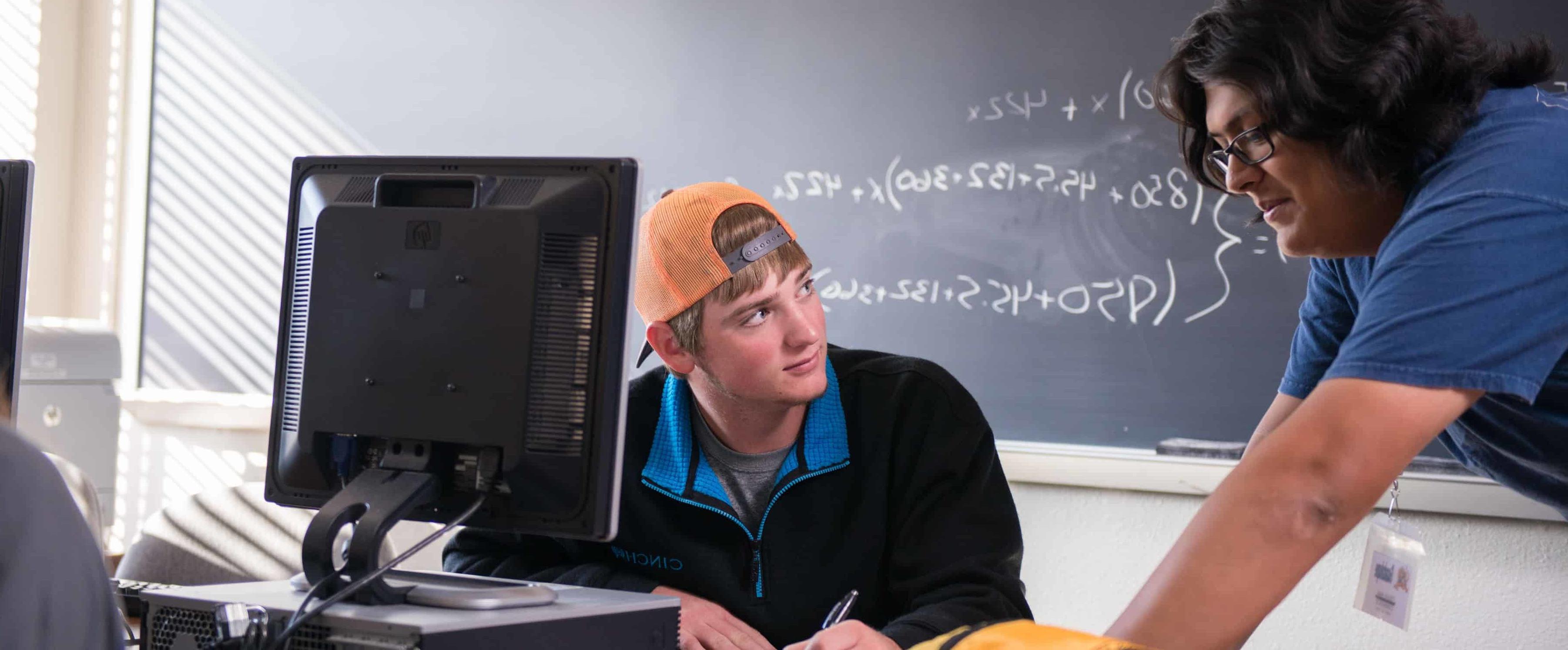 Math instructor helping student