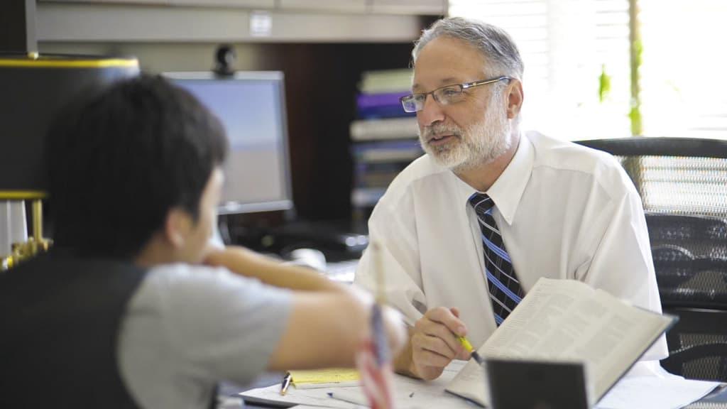 Steve Shwiff speaking with a student