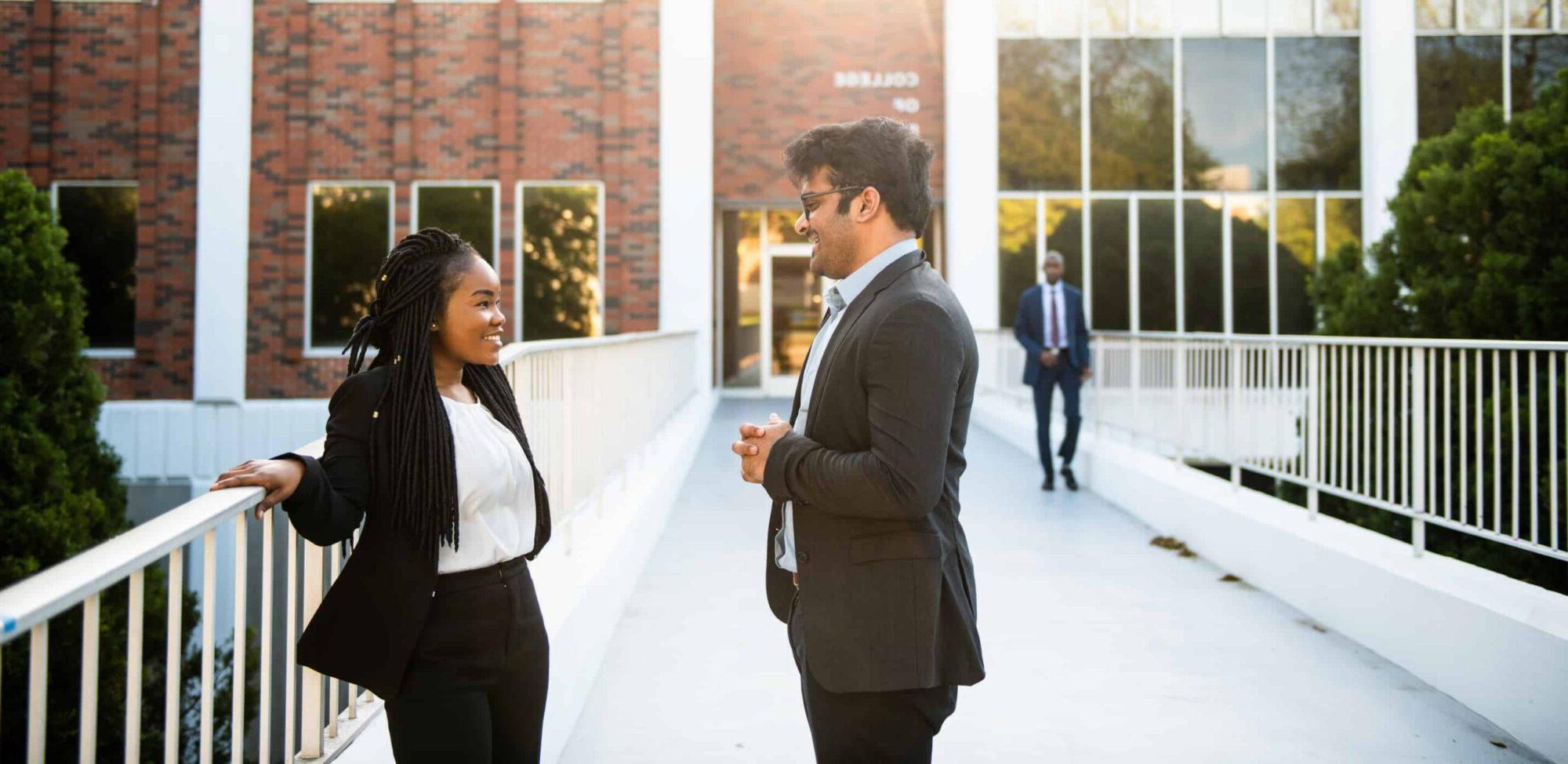 Students interacting to each other outside BA building