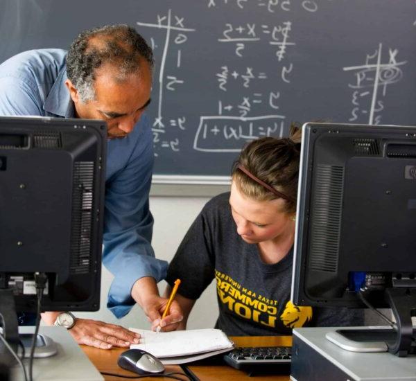 Math professor helping student