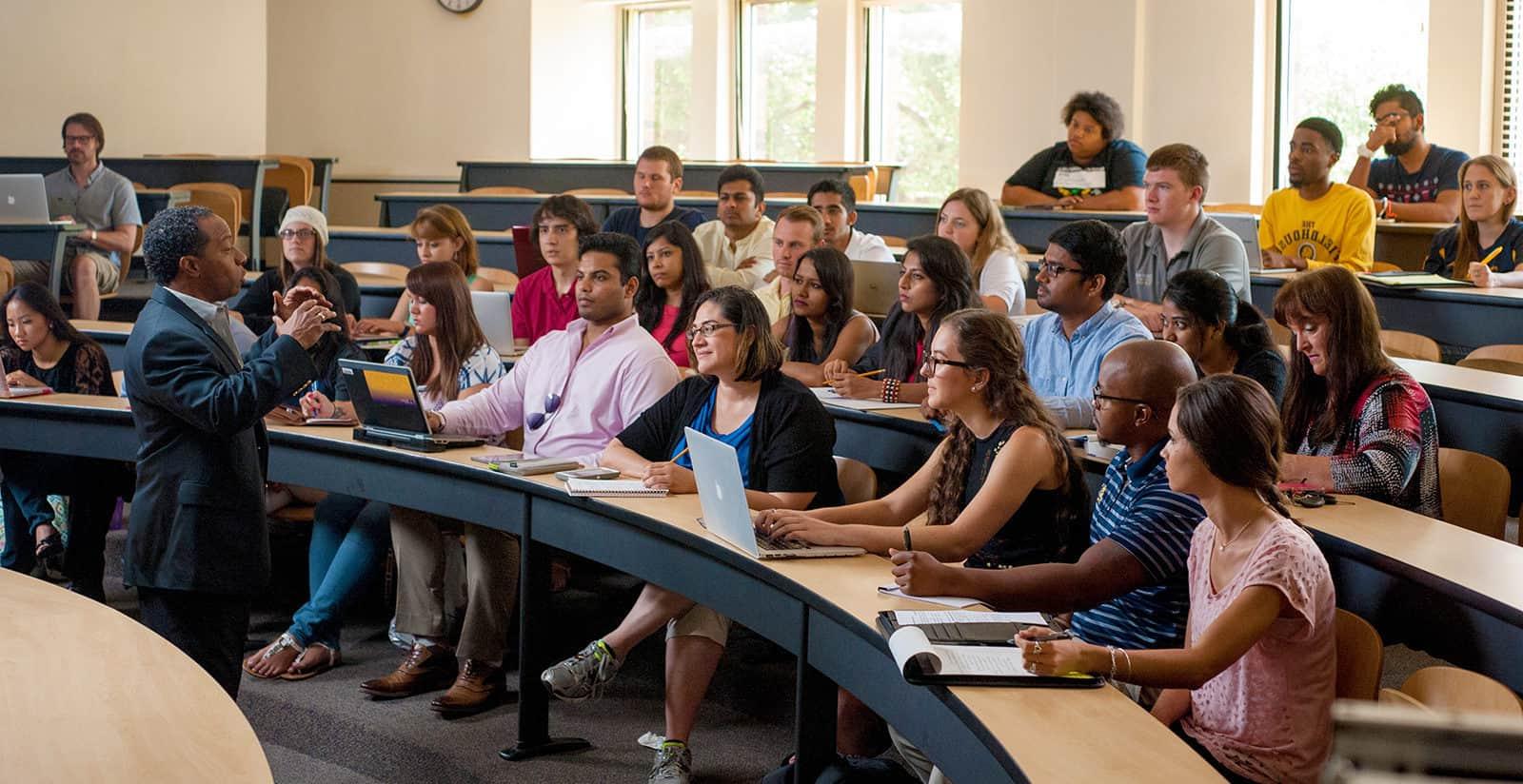 A professor lecturing to a group of students.