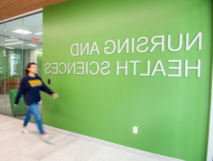 Nursing and Health Sciences sign inside the new health sciences building.