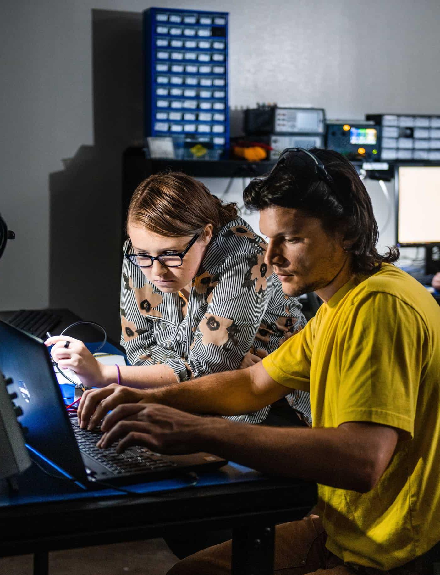 Students working at laptop