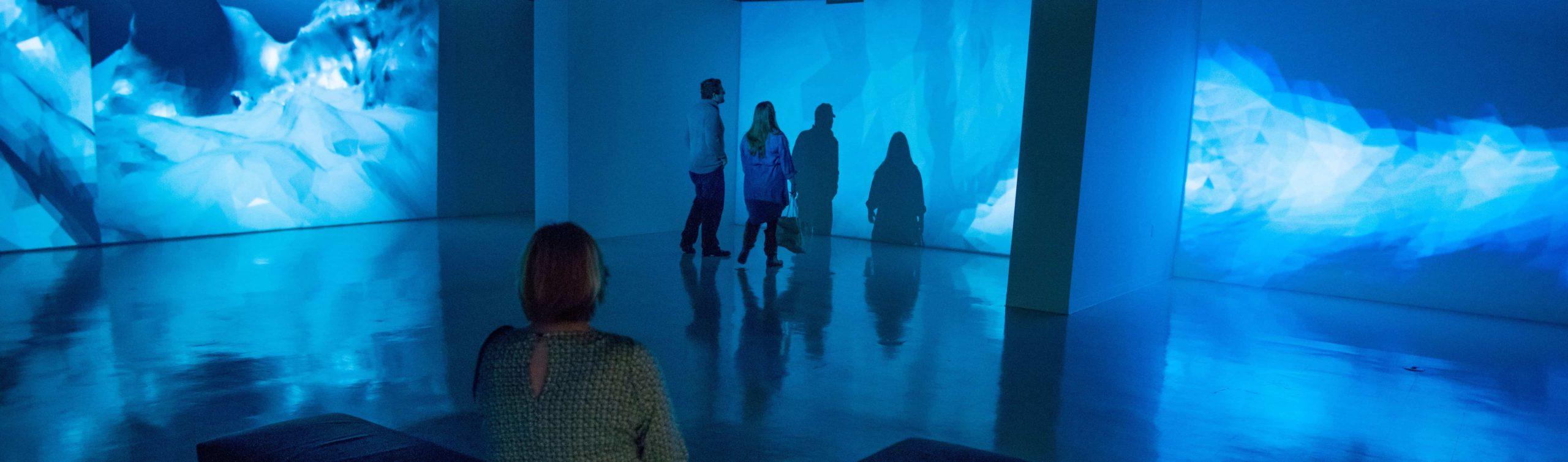 People viewing the university art gallery.