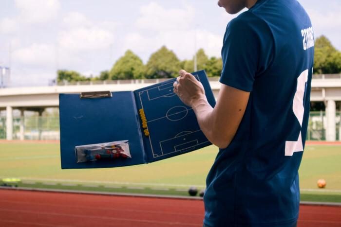 Student gaining hands-on experience as a soccer coach.