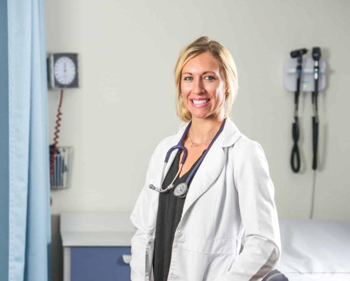 A female nurse student smiling.