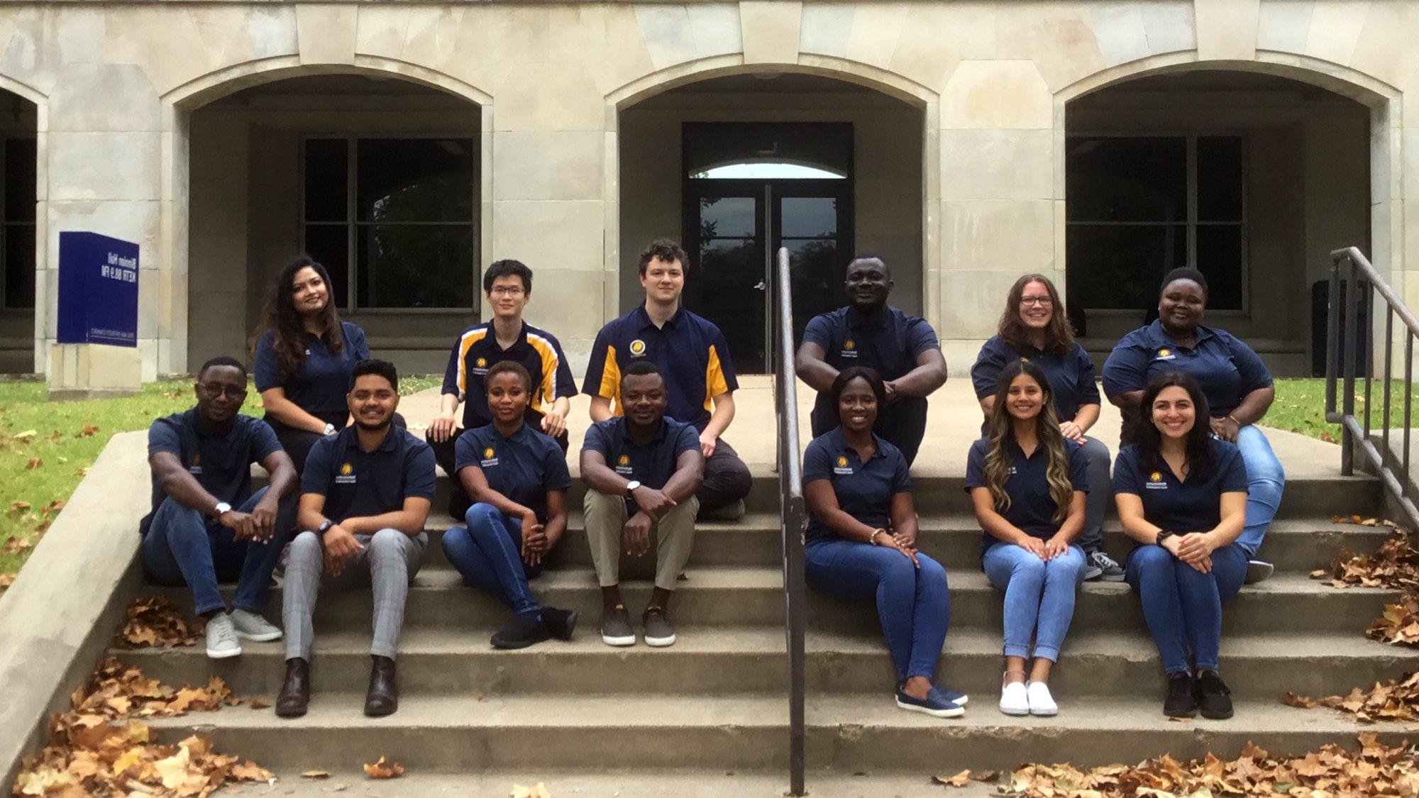 A group of students in front of Binnion Hall. 