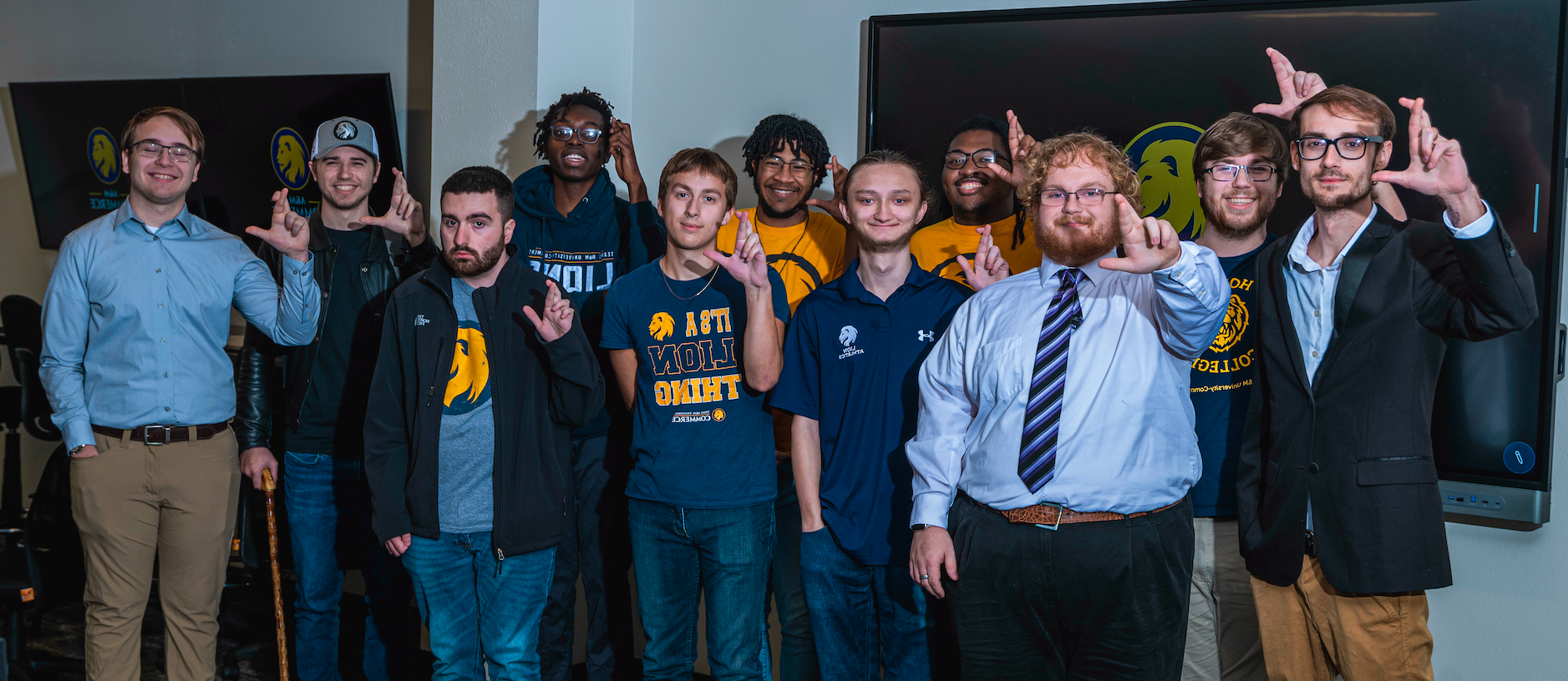 A group of people stand and pose for a photo